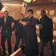 A cyborg Dalek (far left) menaces four characters, including John Barrowman's Captain Jack Harkness, in a scene from "Revolution of the Daleks".